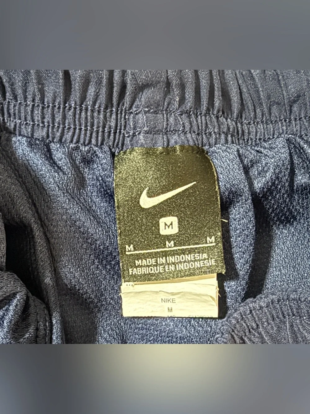 Boys Nike Navy Blue Athletic Shorts with White Stripe, Size M